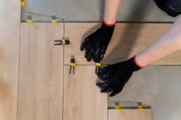 top view worker tiling floor